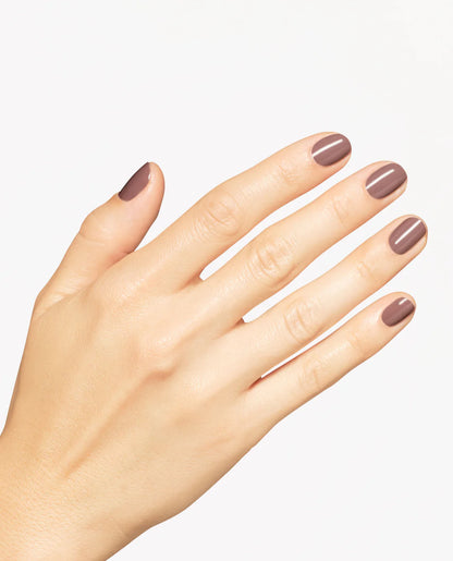 Gel manicure on natural nails displaying OPI GelColor You Don't Know Suzi mocha brown crème glossy finish.