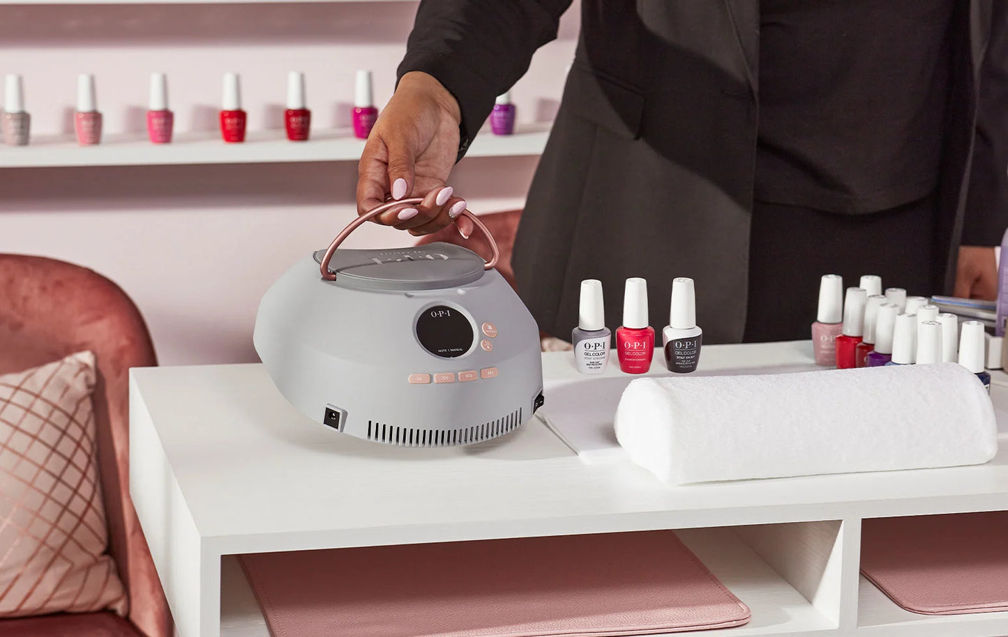 The OPI lamp set up on a professional nail technician's workstation