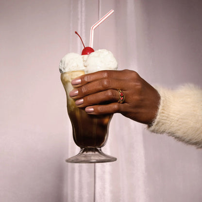 Finished manicure using OPI Route Beer Float gel polish holding root beer float