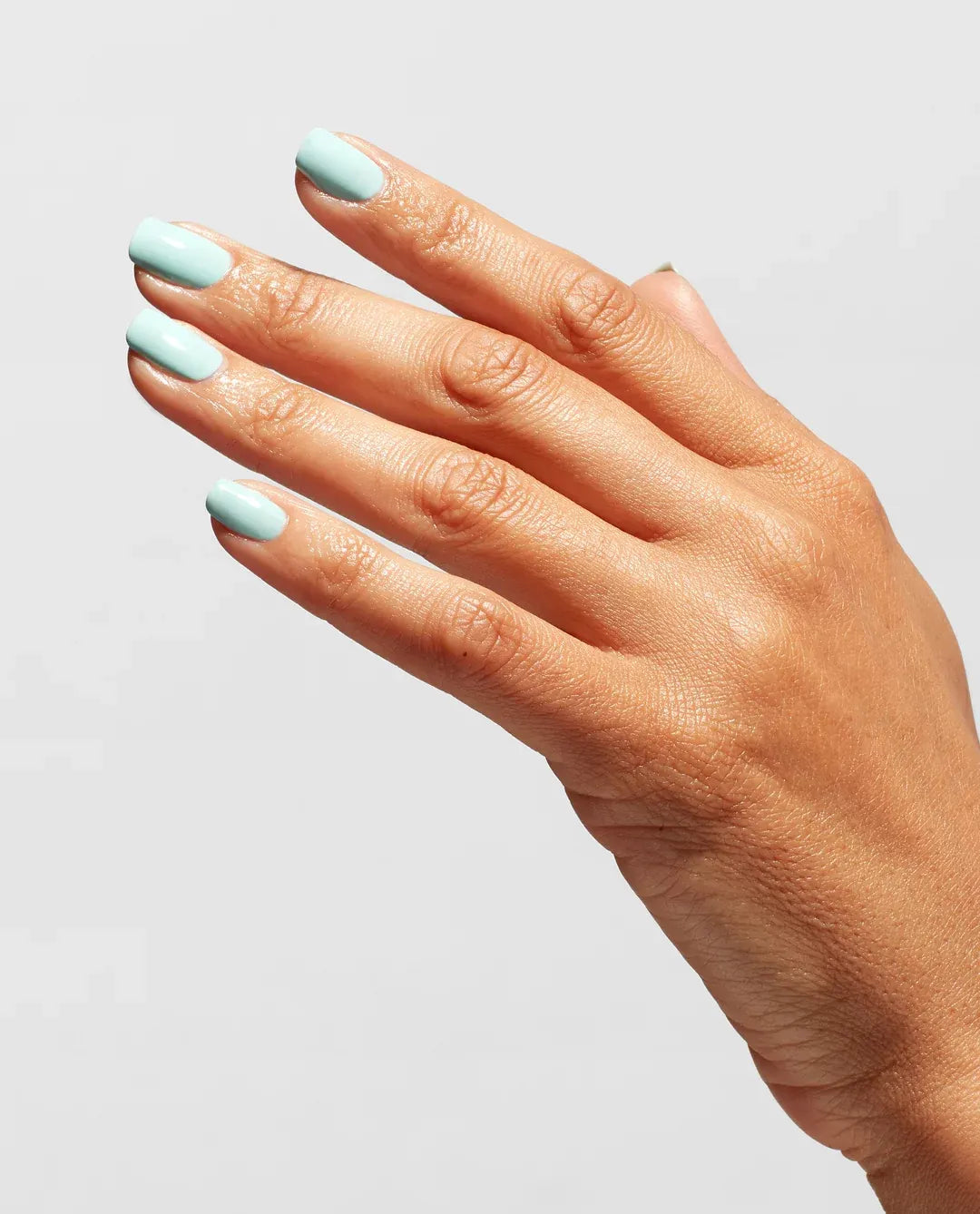 OPI T30 Clear Nail Lacquer Top Coat applied over nail polish for a glossy manicure