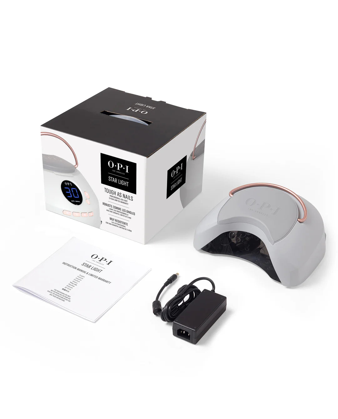 OPI nail lamp with packaging and power cord on a white background