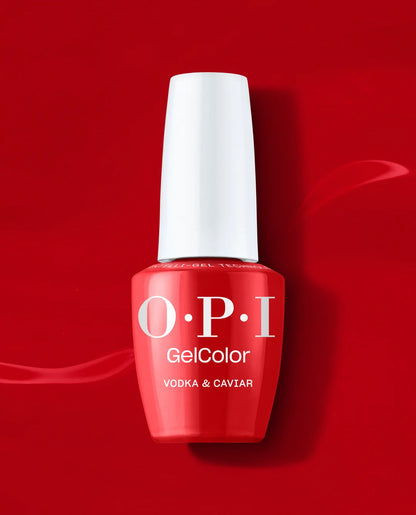 A bottle of OPI GelColor Vodka & Caviar
polish in red shade featuring a bright red bottle and a white cap, set against a solid red background.