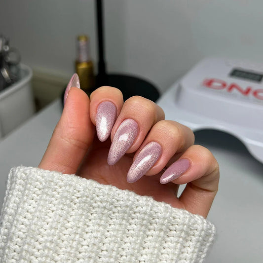 Pink cat eye nails on hand wearing DND DIVA just kitten 28 manicure