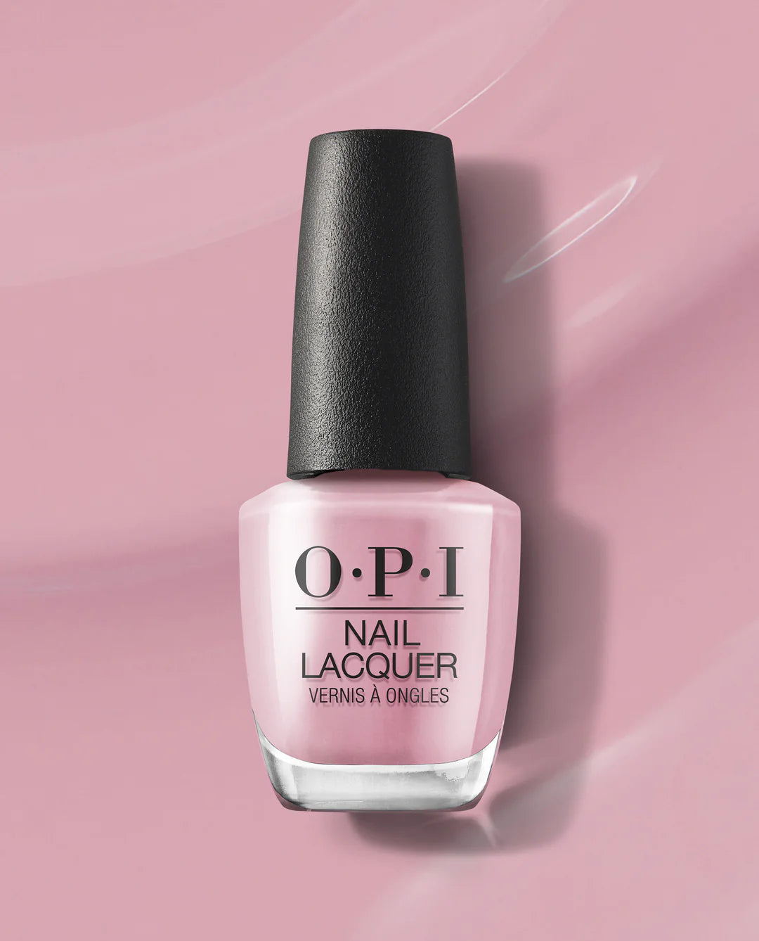 OPI Pink on Canvas nail polish bottle with black cap on a pink background