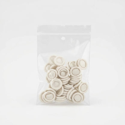 Pack of white rubber finger protectors for salon hygiene and safety