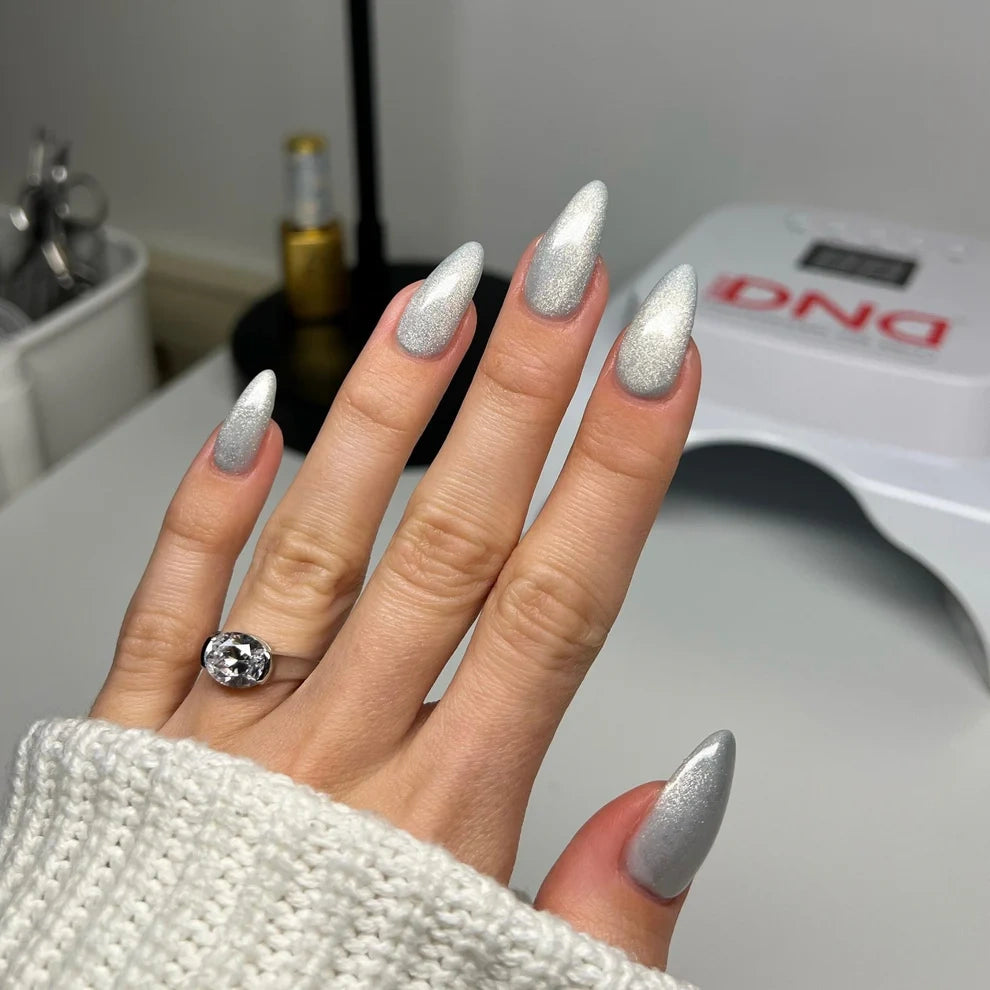 Silver cat eye nails on hand wearing DND DIVA Moonrise 25