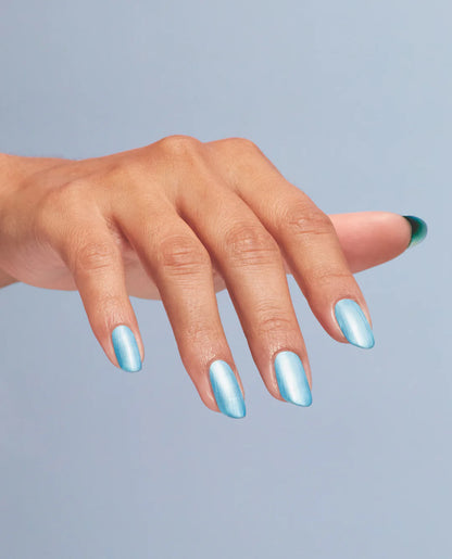 Hand with blue nail polish on a light gray background