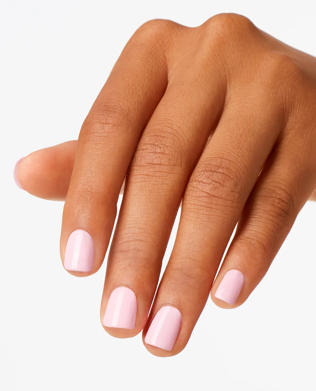 Hand with pink OPI Suzi Shops & Island Hops Gel Polish H71 on a white background