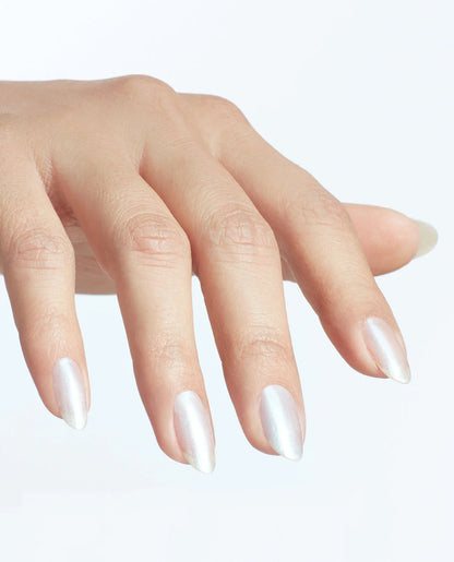 Hand with long, pointed nails on a light background