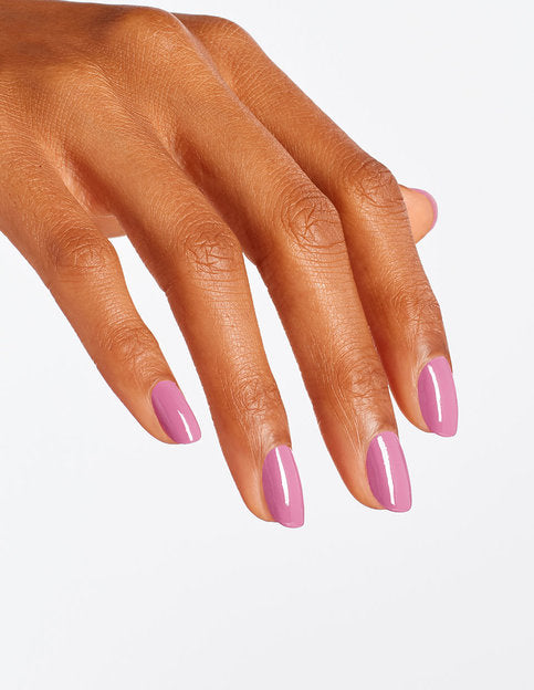 Full manicure using OPI Arigato From Tokyo showing bright coral pink finish on hands.